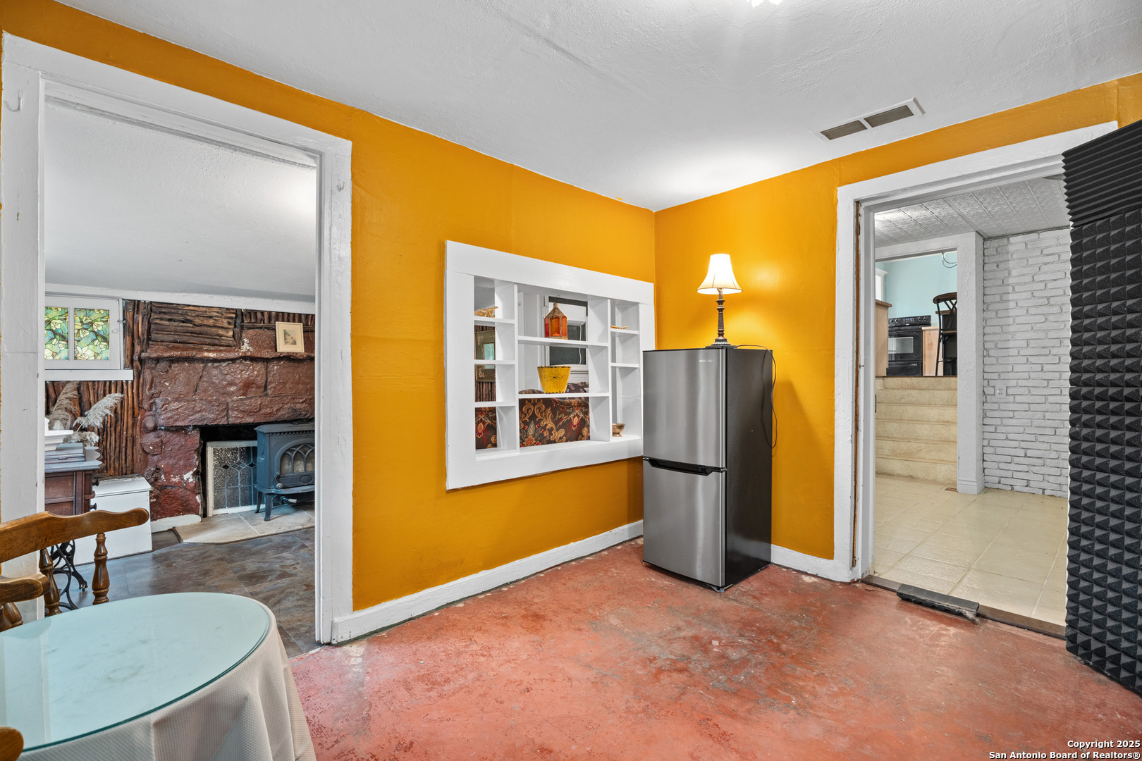 24159 Boerne Stage Road San Antonio, TX 78255 - Photo 76 of 100 a view of a livingroom with a fireplace and workspace