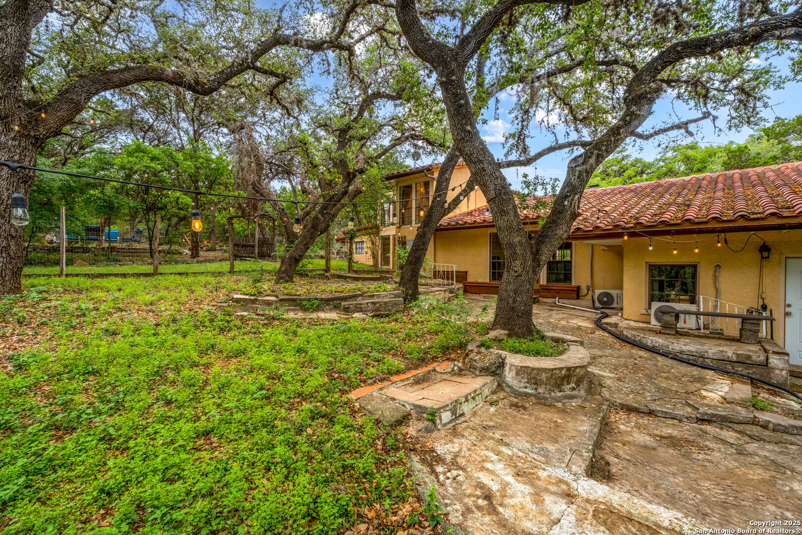 24159 Boerne Stage Road San Antonio, TX 78255 - Photo 82 of 100 a view of a house with backyard and sitting area