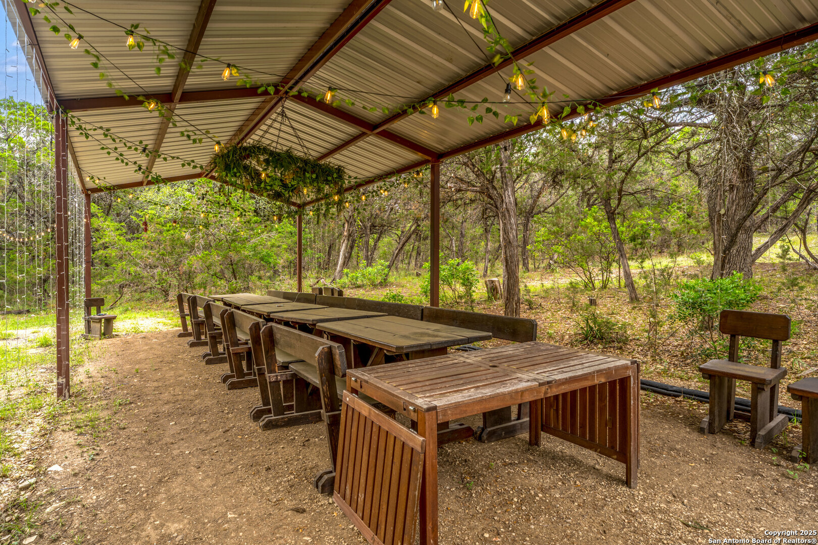 24159 Boerne Stage Road San Antonio, TX 78255 - Photo 89 of 100 a view of a chairs and table in the patio