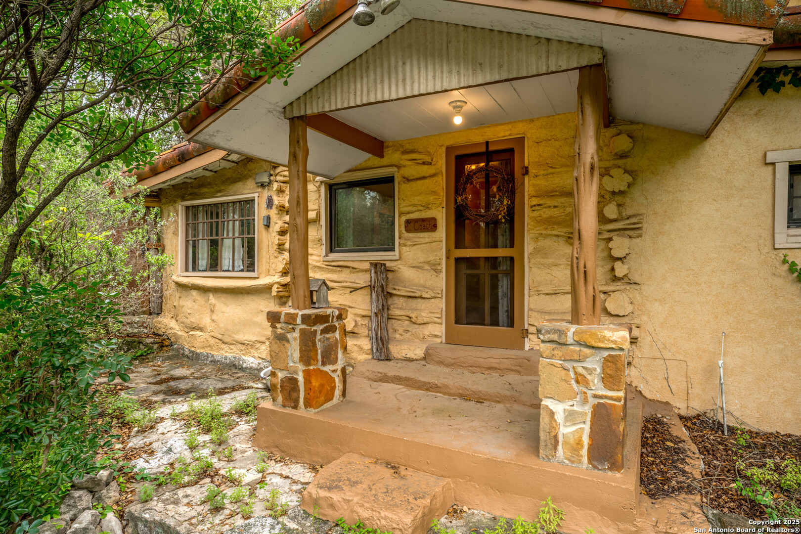 24159 Boerne Stage Road San Antonio, TX 78255 - Photo 91 of 100 a front view of a house with many windows