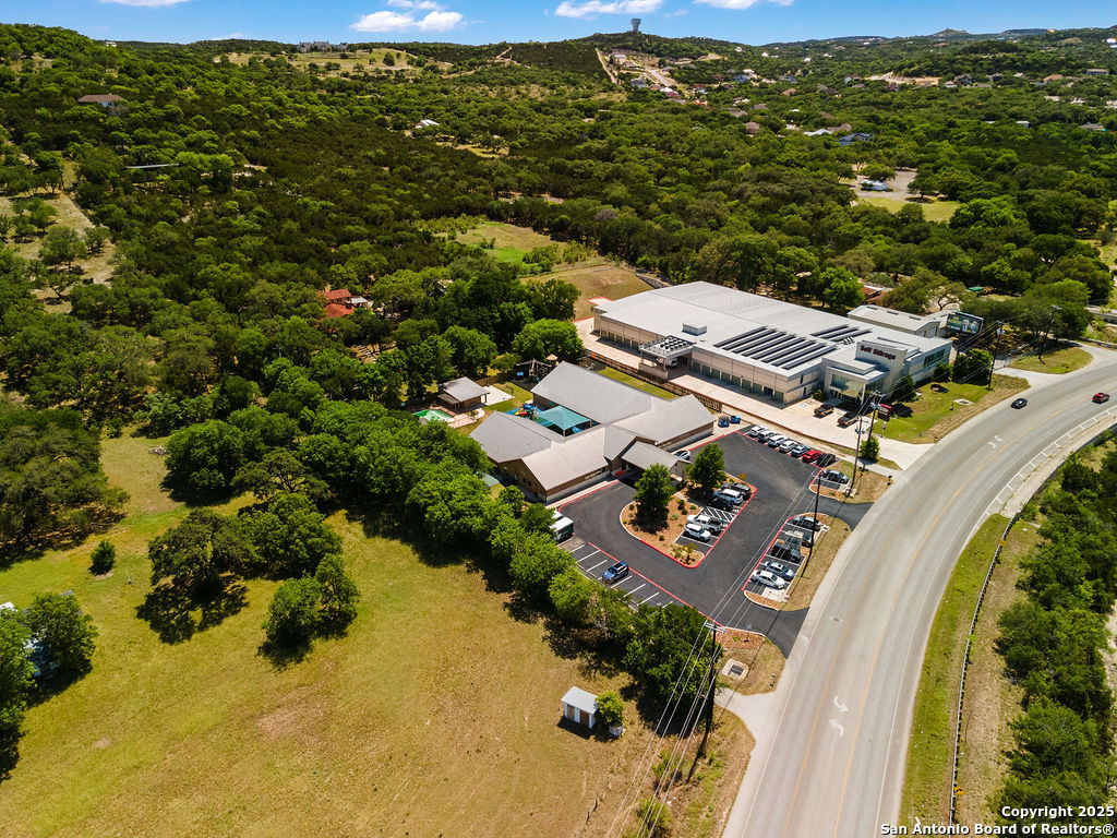 24159 Boerne Stage Road San Antonio, TX 78255 - Photo 99 of 100 an aerial view of residential house with outdoor space and swimming pool
