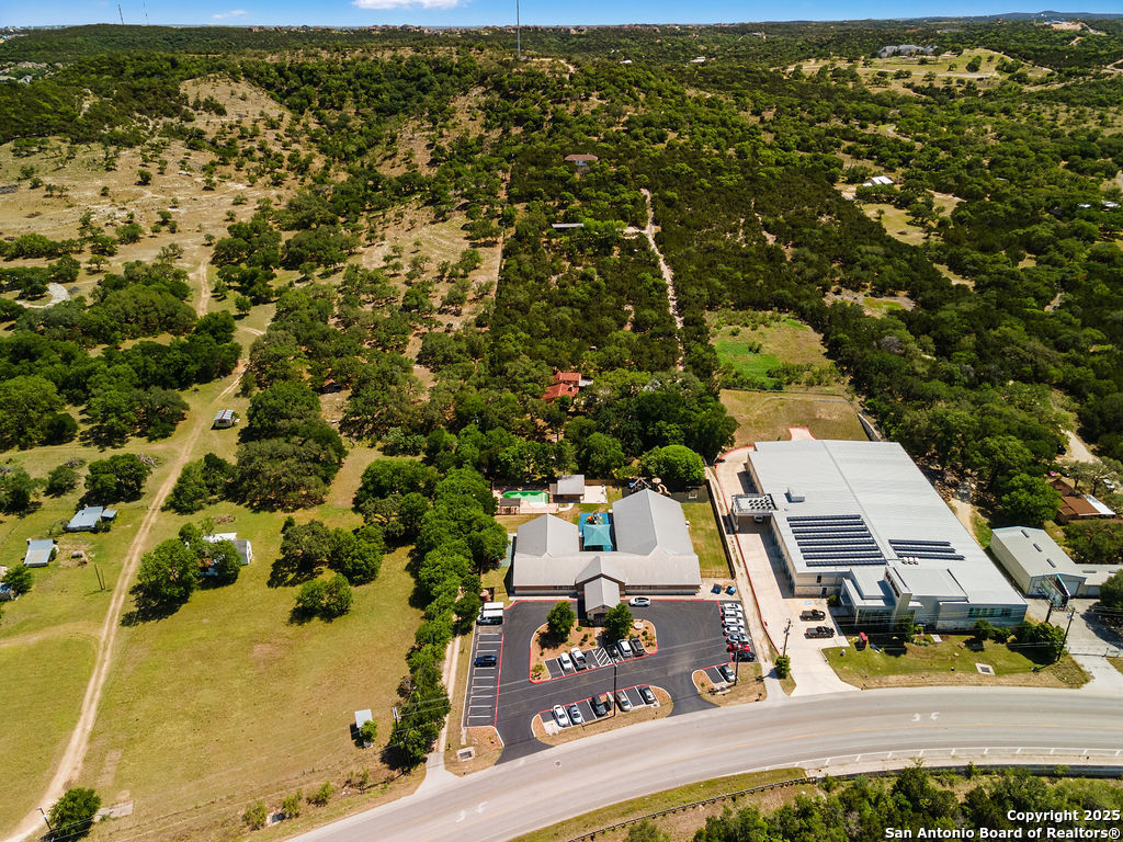 24159 Boerne Stage Road San Antonio, TX 78255 - Photo 100 of 100 an aerial view of residential houses with outdoor space