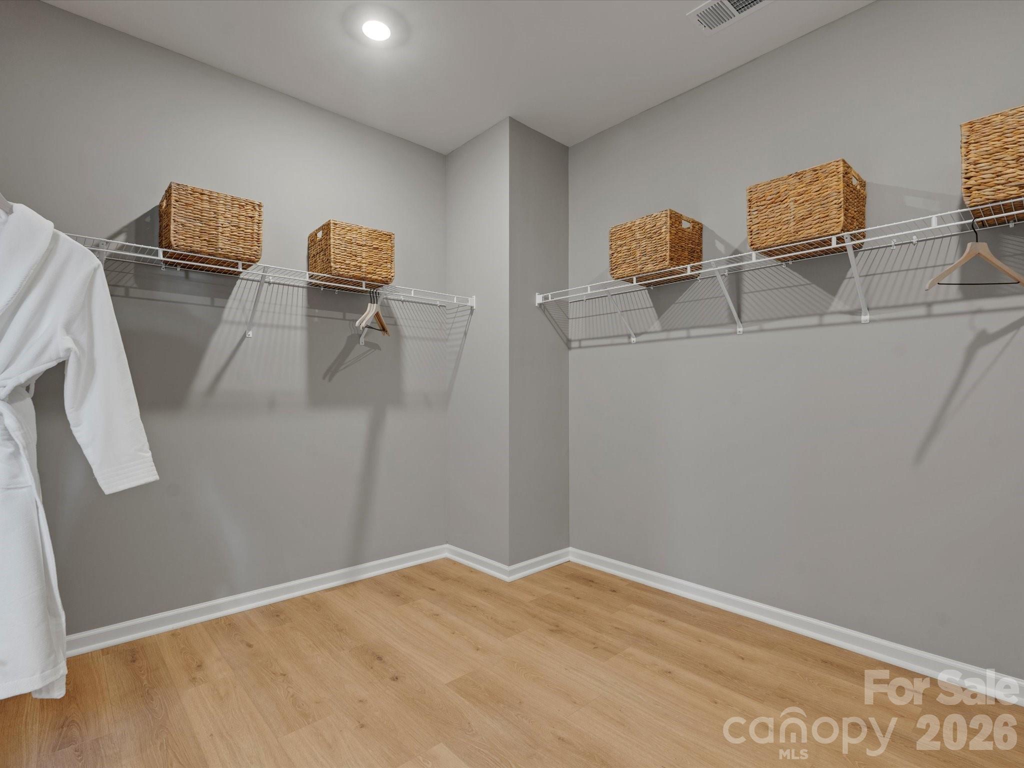 4050 Puddle Pond Road Indian Trail, NC 28079 - Photo 13 of 22 a view of empty room with wooden floor and fan