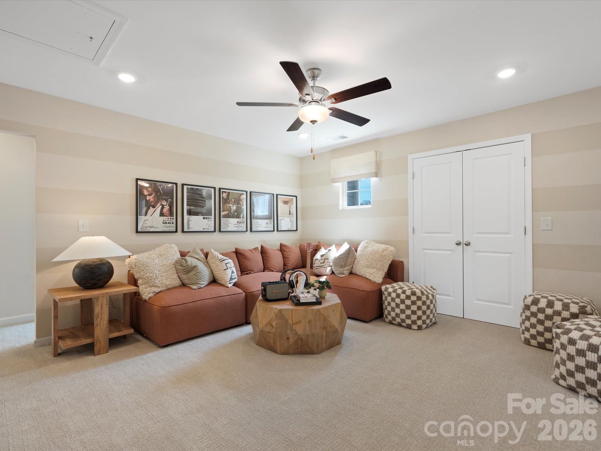 4050 Puddle Pond Road Indian Trail, NC 28079 - Photo 14 of 22 a living room with furniture and ceiling fan