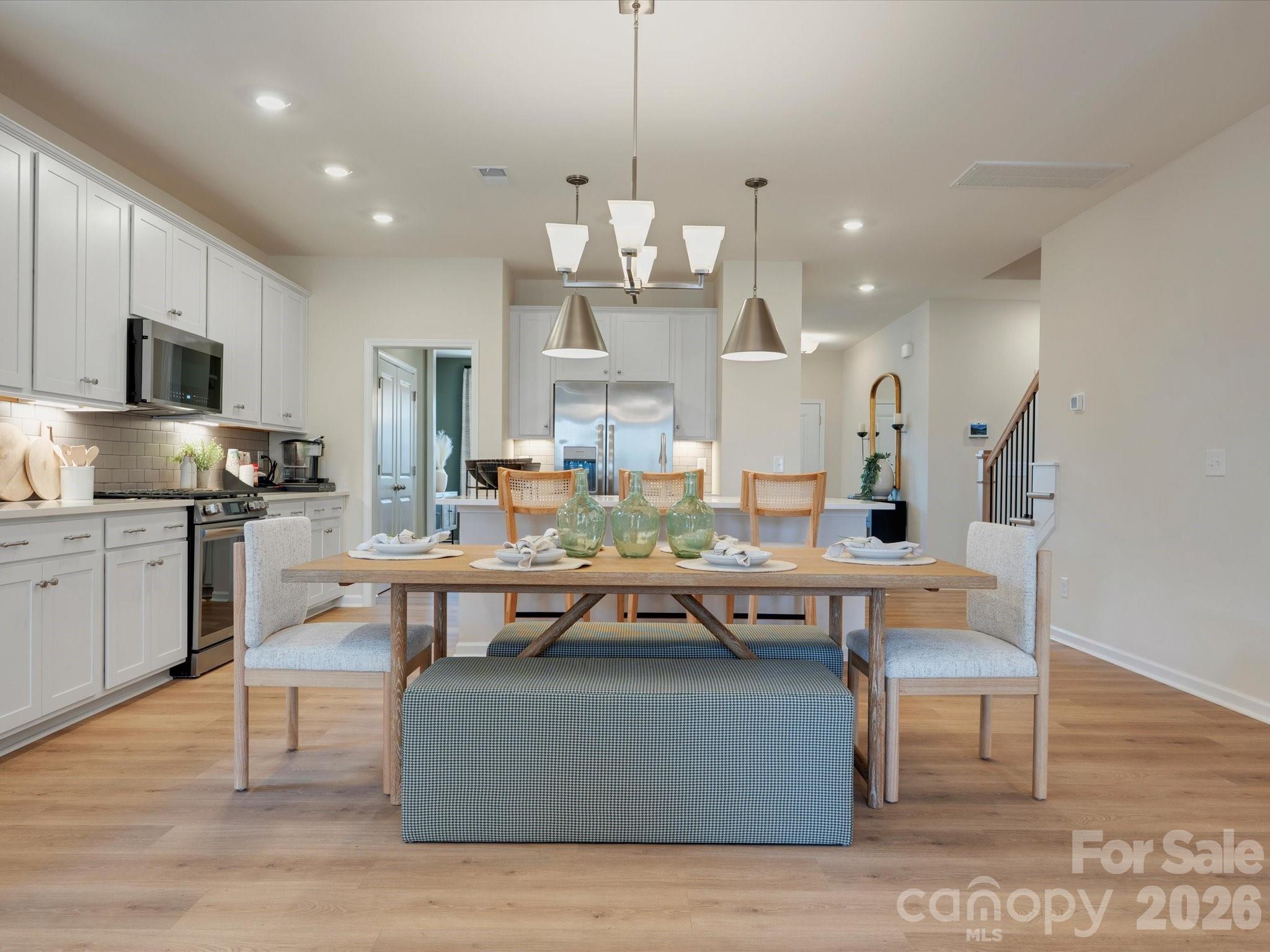 4050 Puddle Pond Road Indian Trail, NC 28079 - Photo 5 of 22 a large kitchen with a table and chairs