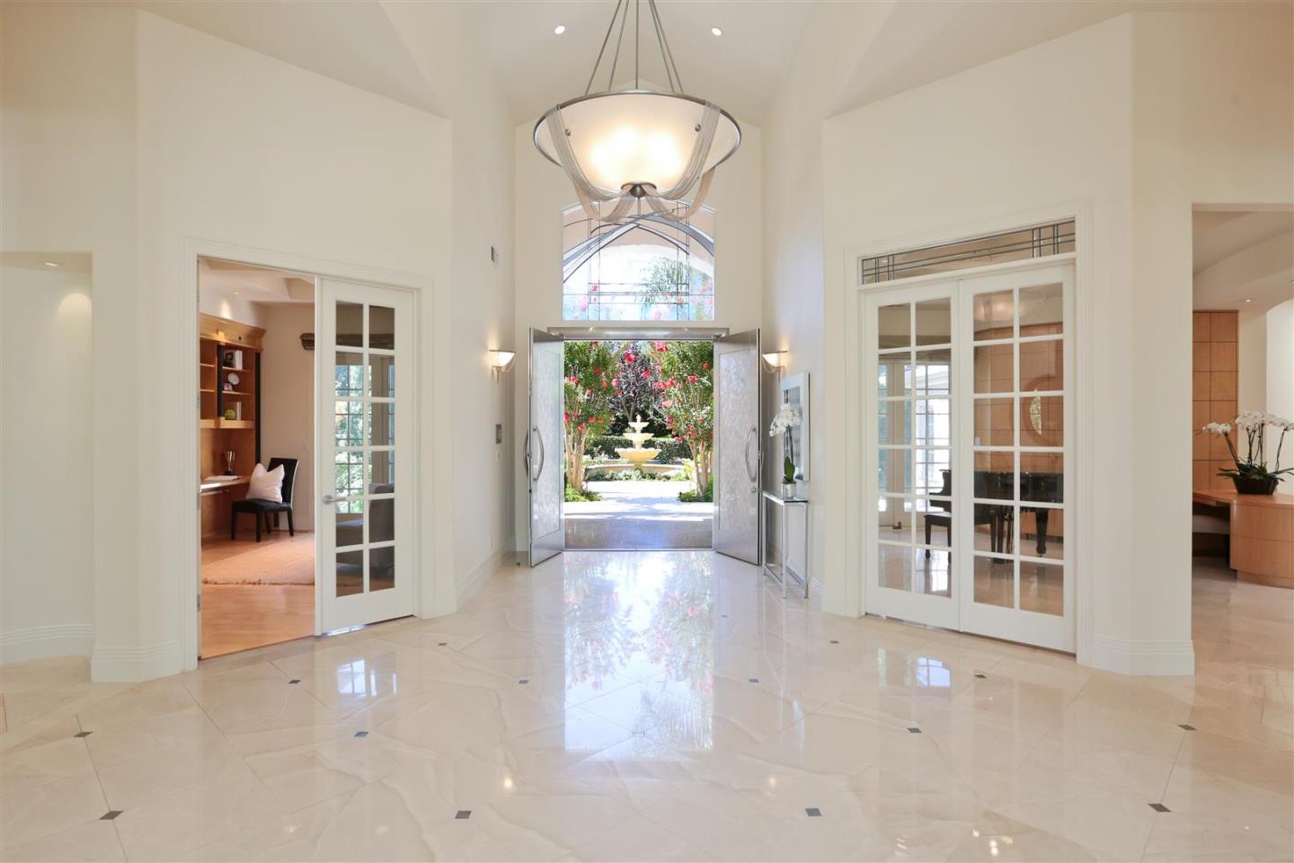 24289 Hillview Road Los Altos Hills, CA 94024 - Photo 11 of 32 an empty room with windows and entrance
