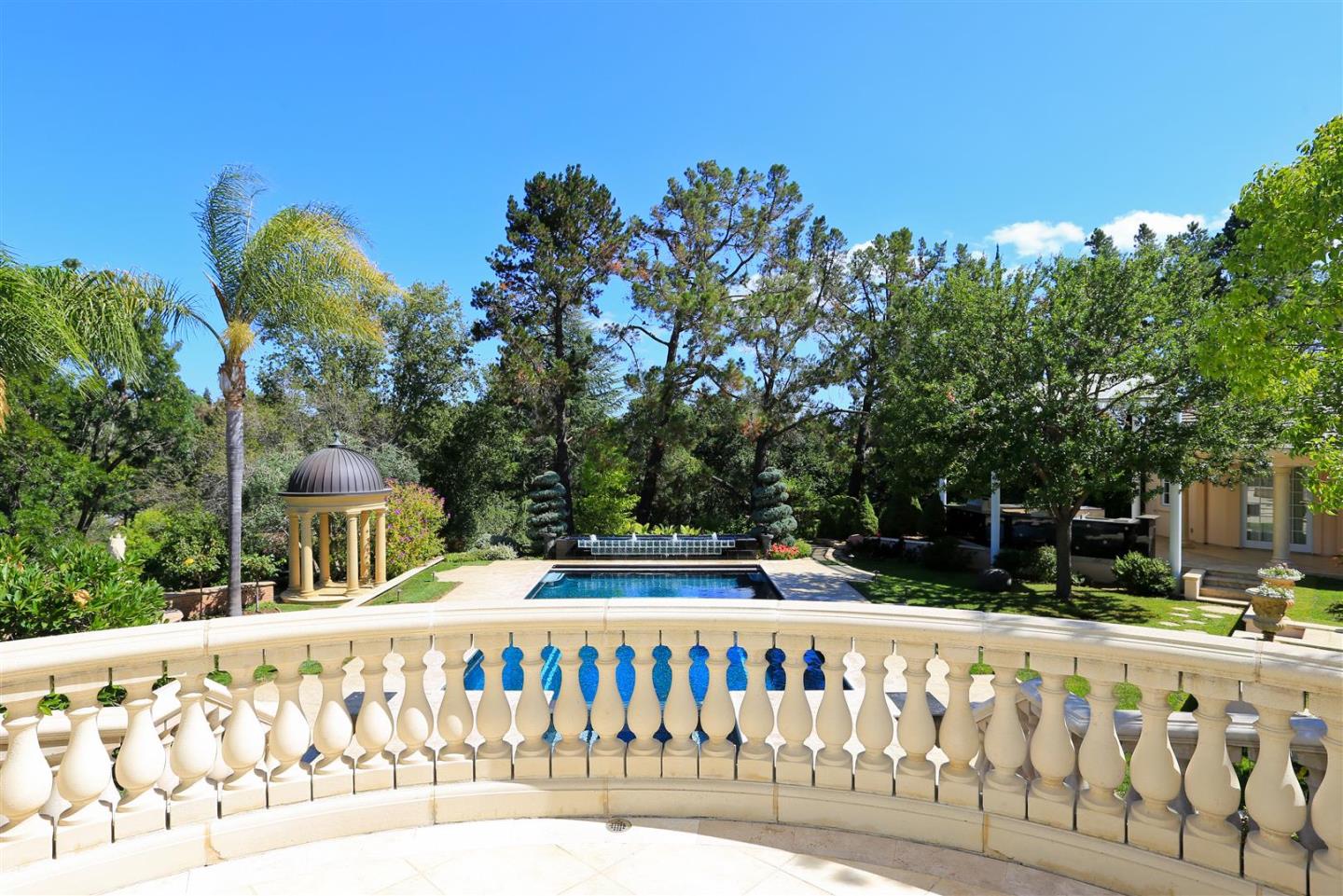 24289 Hillview Road Los Altos Hills, CA 94024 - Photo 13 of 32 a front view of a house with a garden
