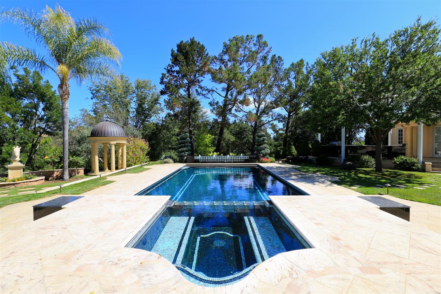 24289 Hillview Road Los Altos Hills, CA 94024 - Photo 14 of 32 a view of backyard with swimming pool and outdoor seating