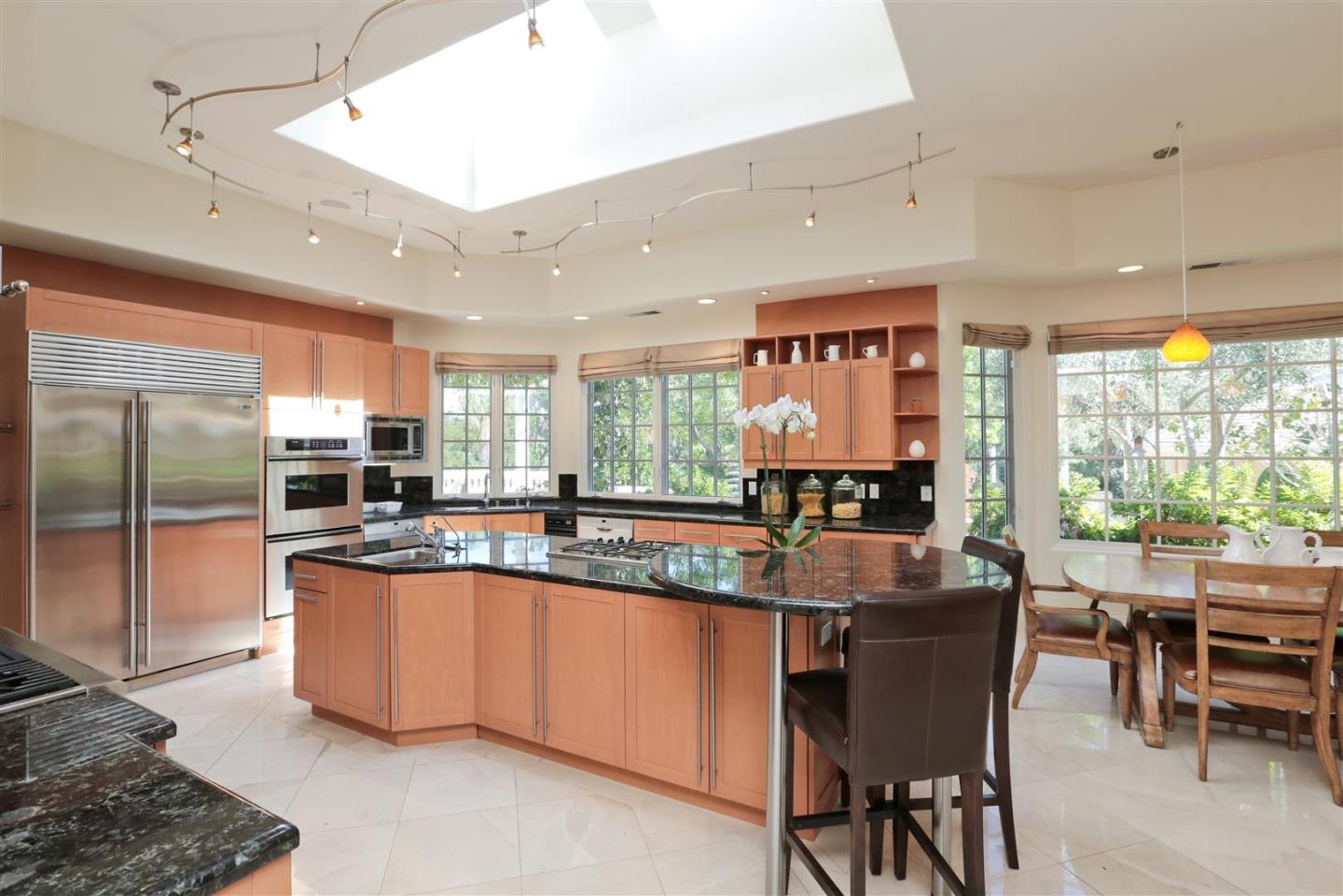 24289 Hillview Road Los Altos Hills, CA 94024 - Photo 15 of 32 a kitchen with stainless steel appliances granite countertop a stove and a refrigerator