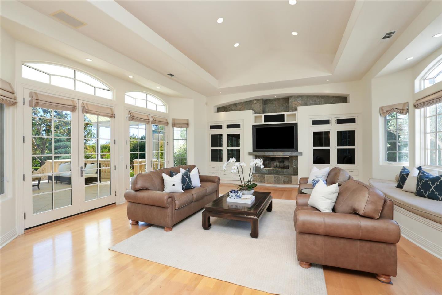 24289 Hillview Road Los Altos Hills, CA 94024 - Photo 17 of 32 a living room with furniture and a flat screen tv