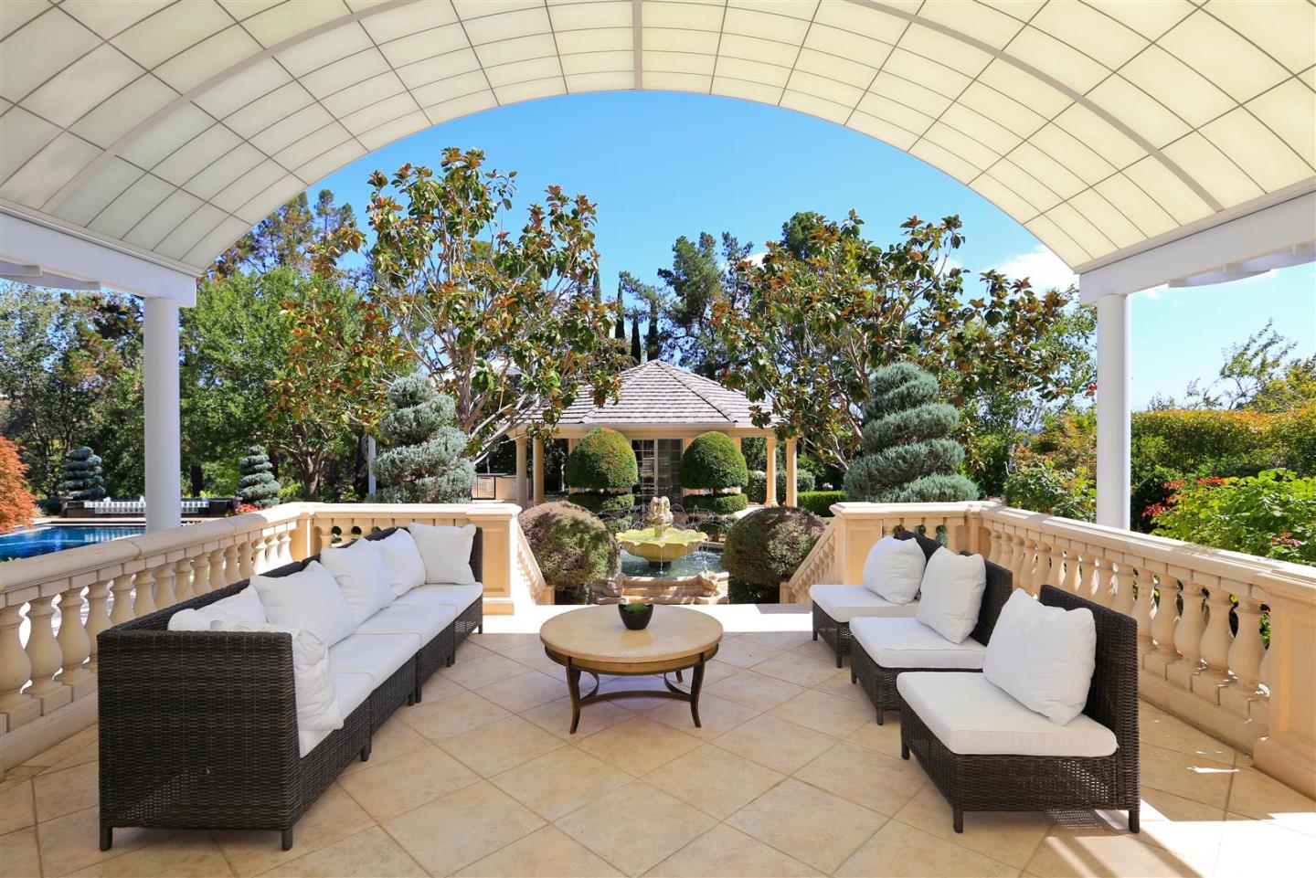 24289 Hillview Road Los Altos Hills, CA 94024 - Photo 19 of 32 a outdoor living space with furniture and a potted plant