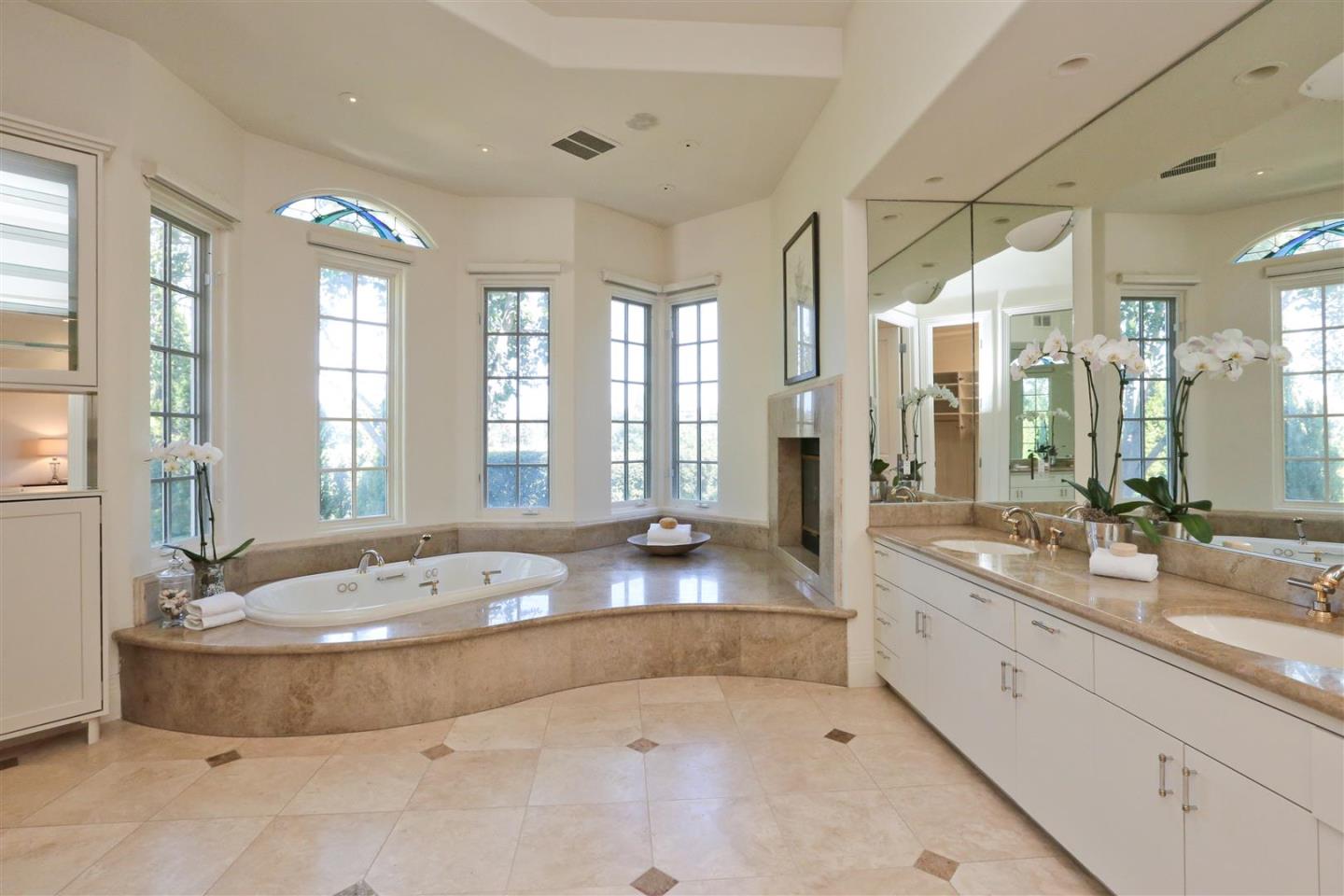 24289 Hillview Road Los Altos Hills, CA 94024 - Photo 22 of 32 a large spacious bathroom with a large tub and double vanity