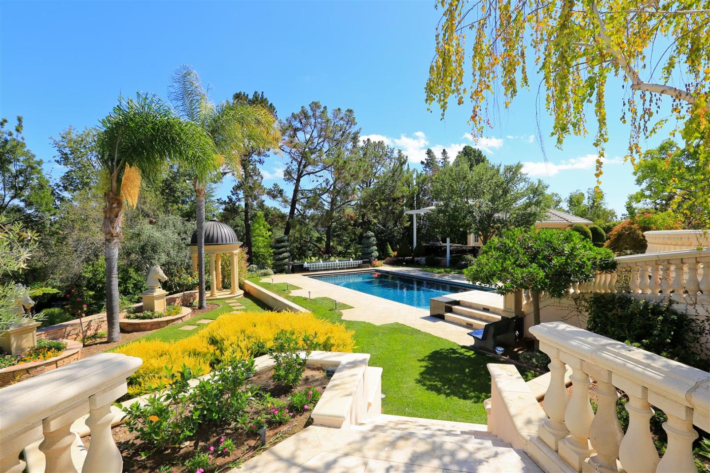 24289 Hillview Road Los Altos Hills, CA 94024 - Photo 23 of 32 a view of a swimming pool with a patio
