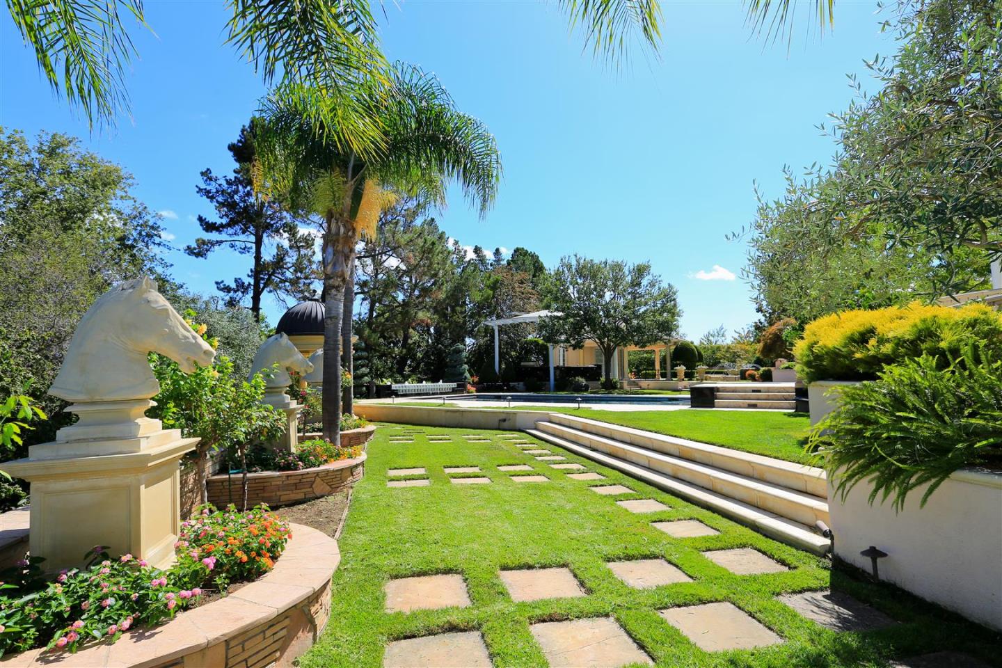 24289 Hillview Road Los Altos Hills, CA 94024 - Photo 24 of 32 a view of a swimming pool with a garden and plants