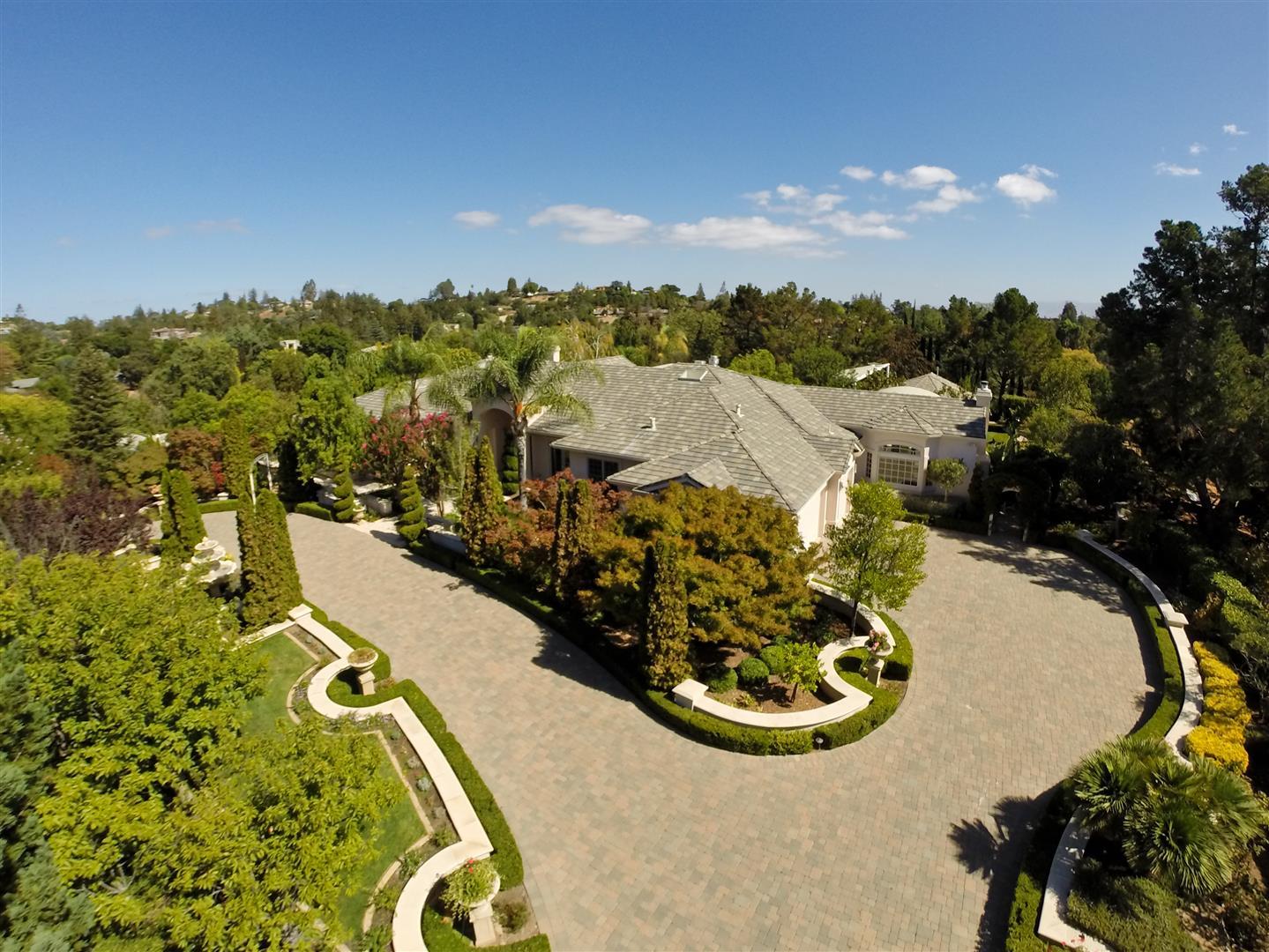 24289 Hillview Road Los Altos Hills, CA 94024 - Photo 3 of 32 a view of a swimming pool with a garden