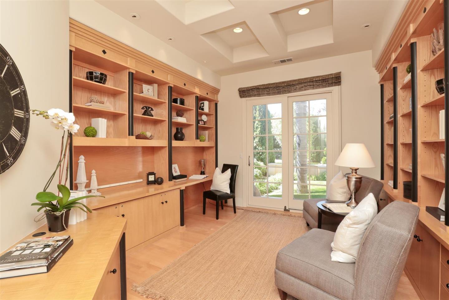 24289 Hillview Road Los Altos Hills, CA 94024 - Photo 9 of 32 a living room with furniture cabinets and a large window