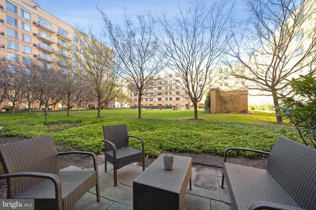 a view of a patio with a yard