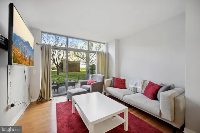 a living room with furniture and a large window