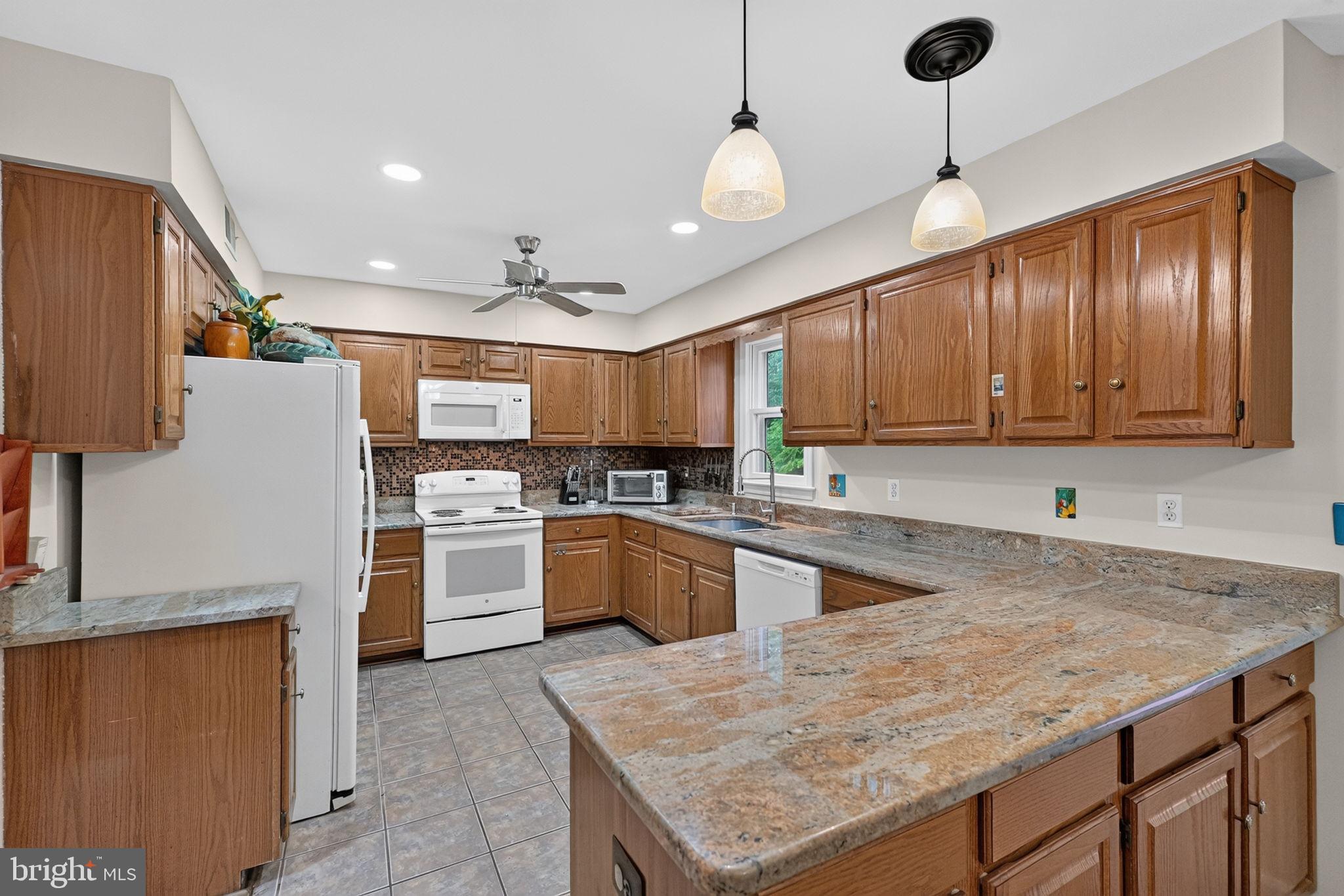 14929 Notley Road Silver Spring, MD 20905 - Photo 15 of 69 Kitchen with Granite Counter Tops