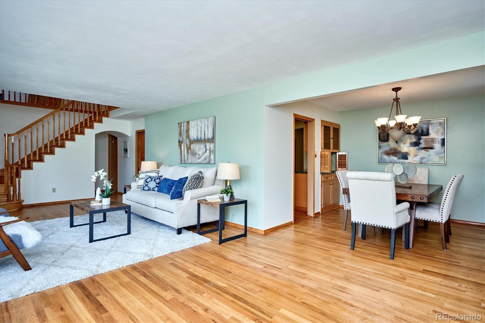 22 Rangeview Drive Wheat Ridge, CO 80215 - Photo 13 of 40 a living room with furniture and wooden floor