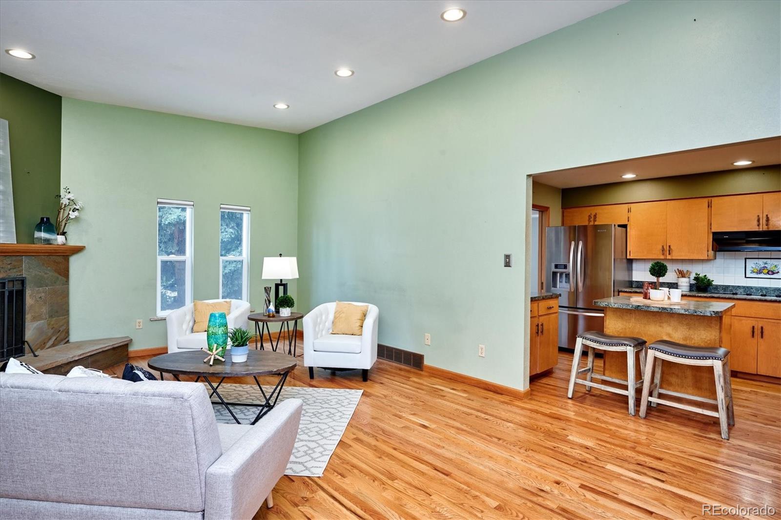 22 Rangeview Drive Wheat Ridge, CO 80215 - Photo 18 of 40 a living room with furniture and wooden floor