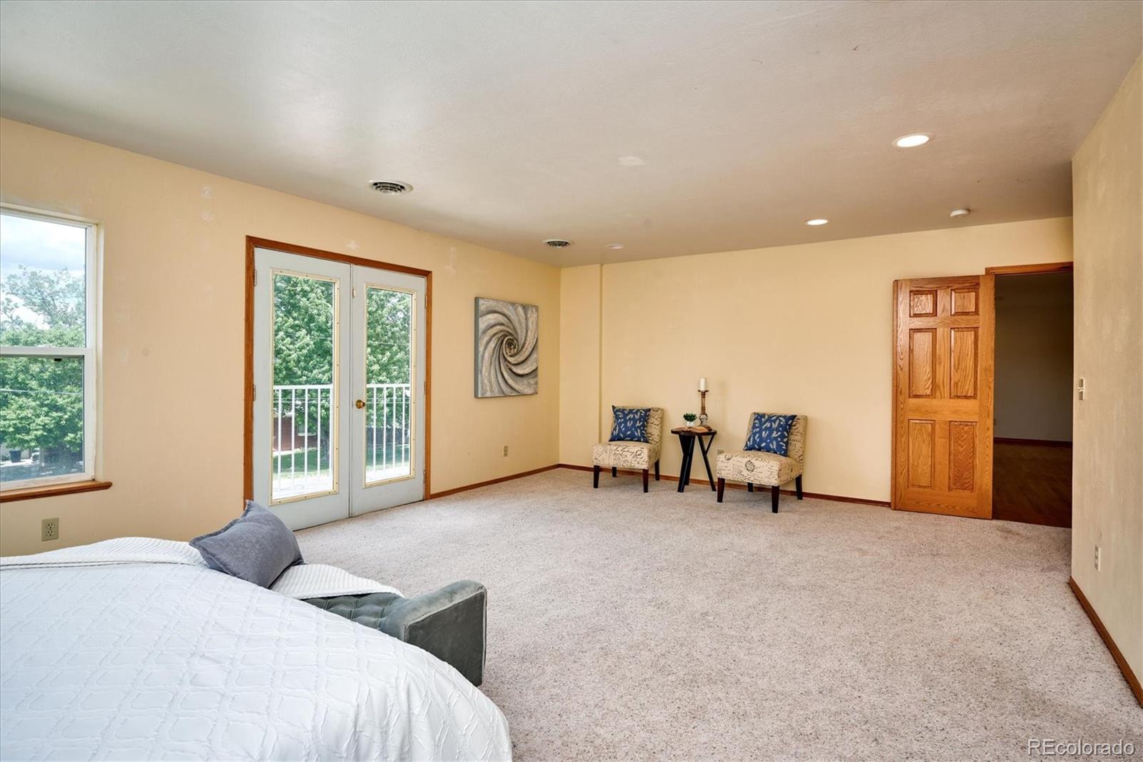 22 Rangeview Drive Wheat Ridge, CO 80215 - Photo 21 of 40 a bedroom with furniture and a window