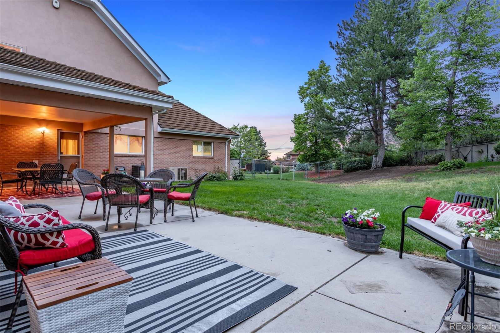 22 Rangeview Drive Wheat Ridge, CO 80215 - Photo 3 of 40 a view of a tables and chairs in the patio in front of the house