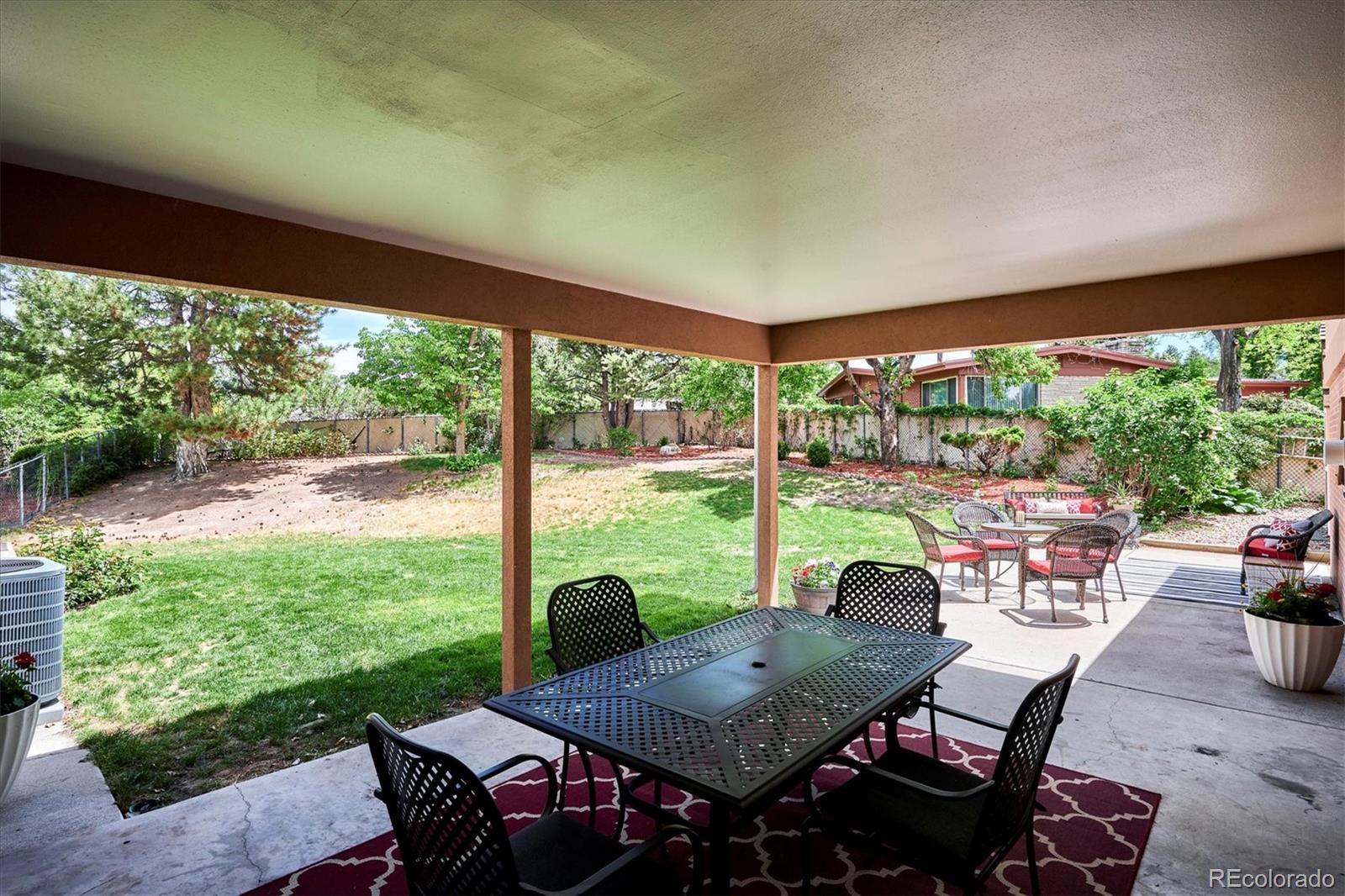 22 Rangeview Drive Wheat Ridge, CO 80215 - Photo 35 of 40 a view of a porch with furniture and a backyard