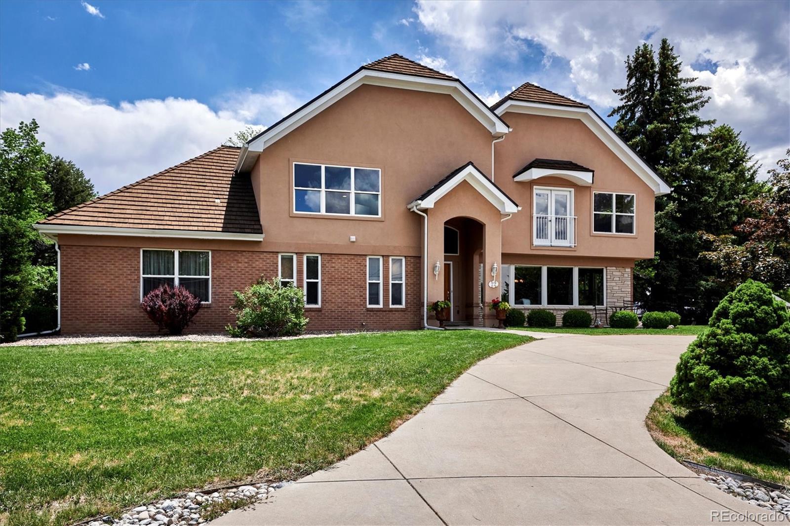 22 Rangeview Drive Wheat Ridge, CO 80215 - Photo 5 of 40 a front view of a house with a yard