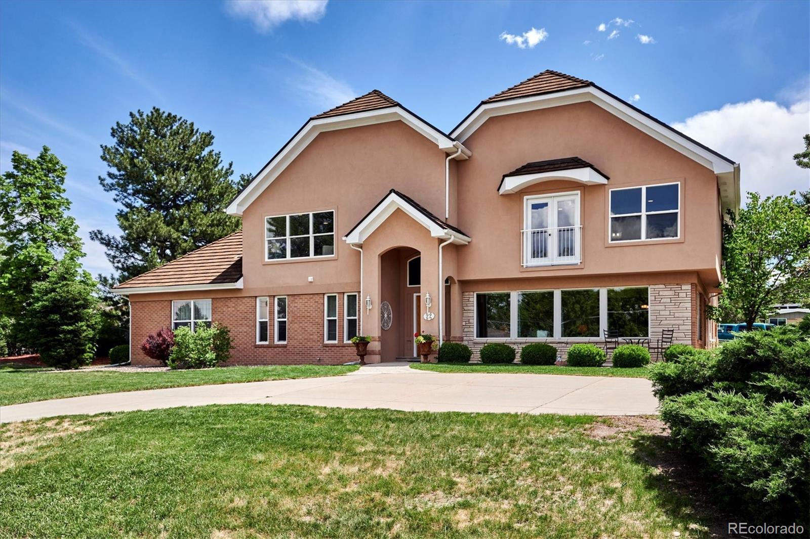 22 Rangeview Drive Wheat Ridge, CO 80215 - Photo 6 of 40 a front view of a house with a yard