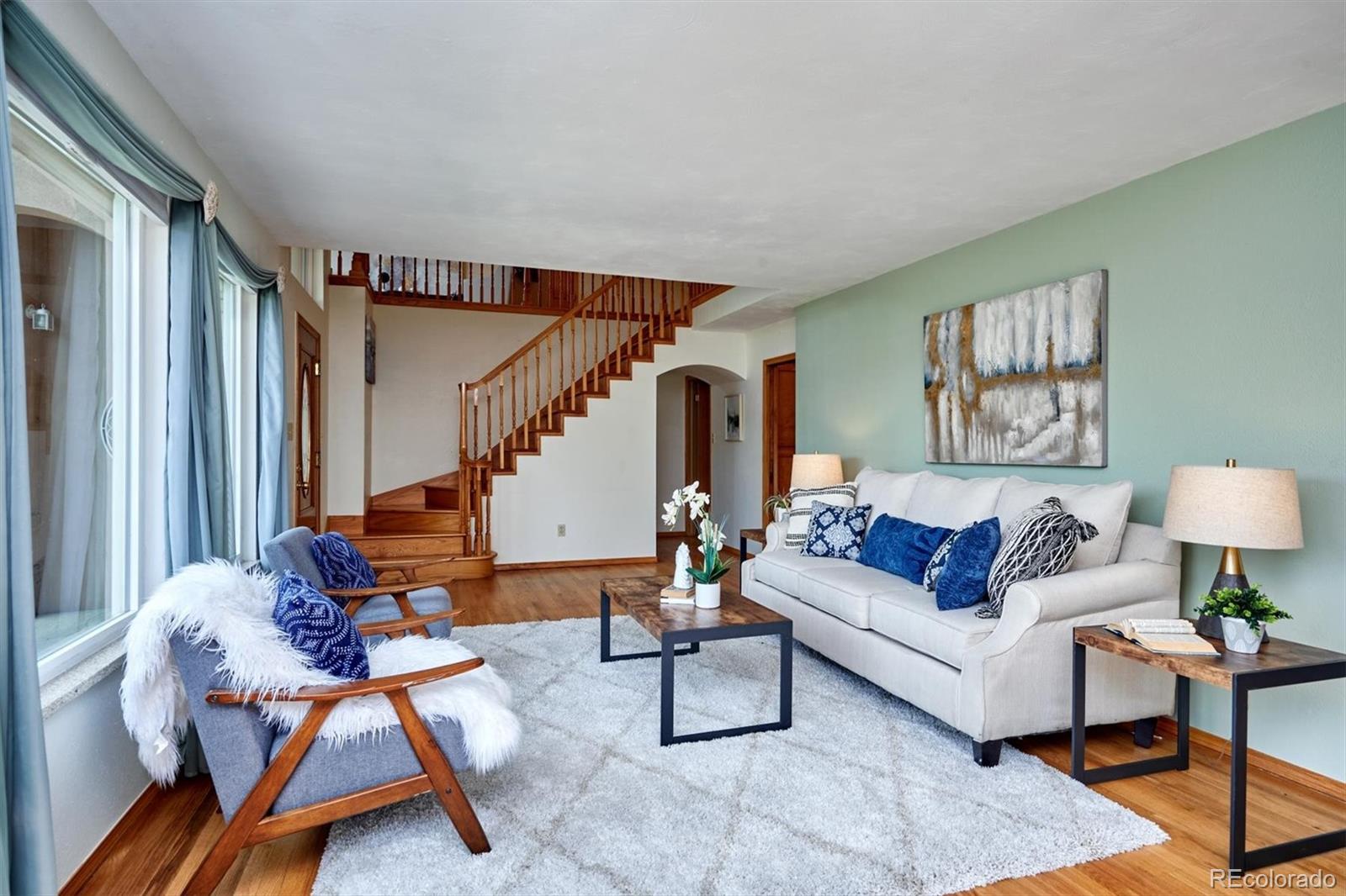 22 Rangeview Drive Wheat Ridge, CO 80215 - Photo 10 of 40 a living room with furniture and a potted plant
