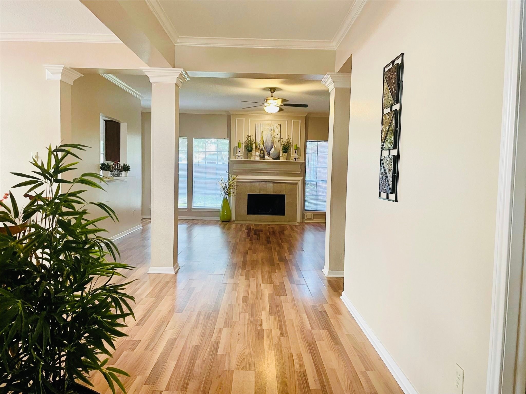 14527 Circlewood Way Houston, TX 77062 - Photo 2 of 14 a view of a hallway view with wooden floor and staircase