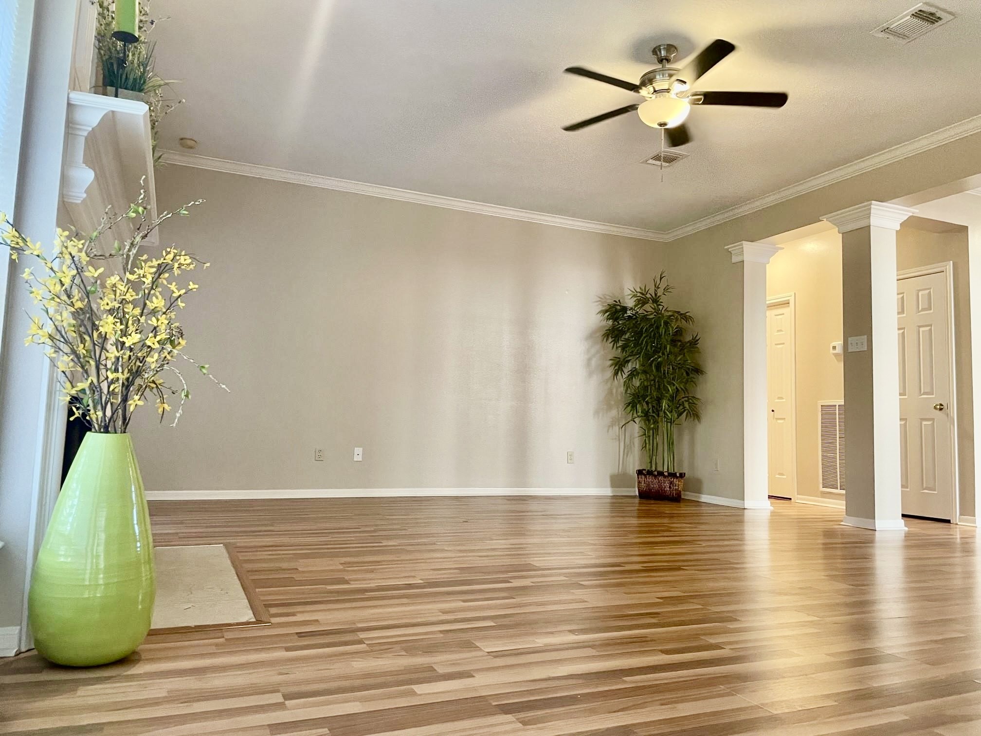 14527 Circlewood Way Houston, TX 77062 - Photo 4 of 14 a view of empty room with wooden floor and fan