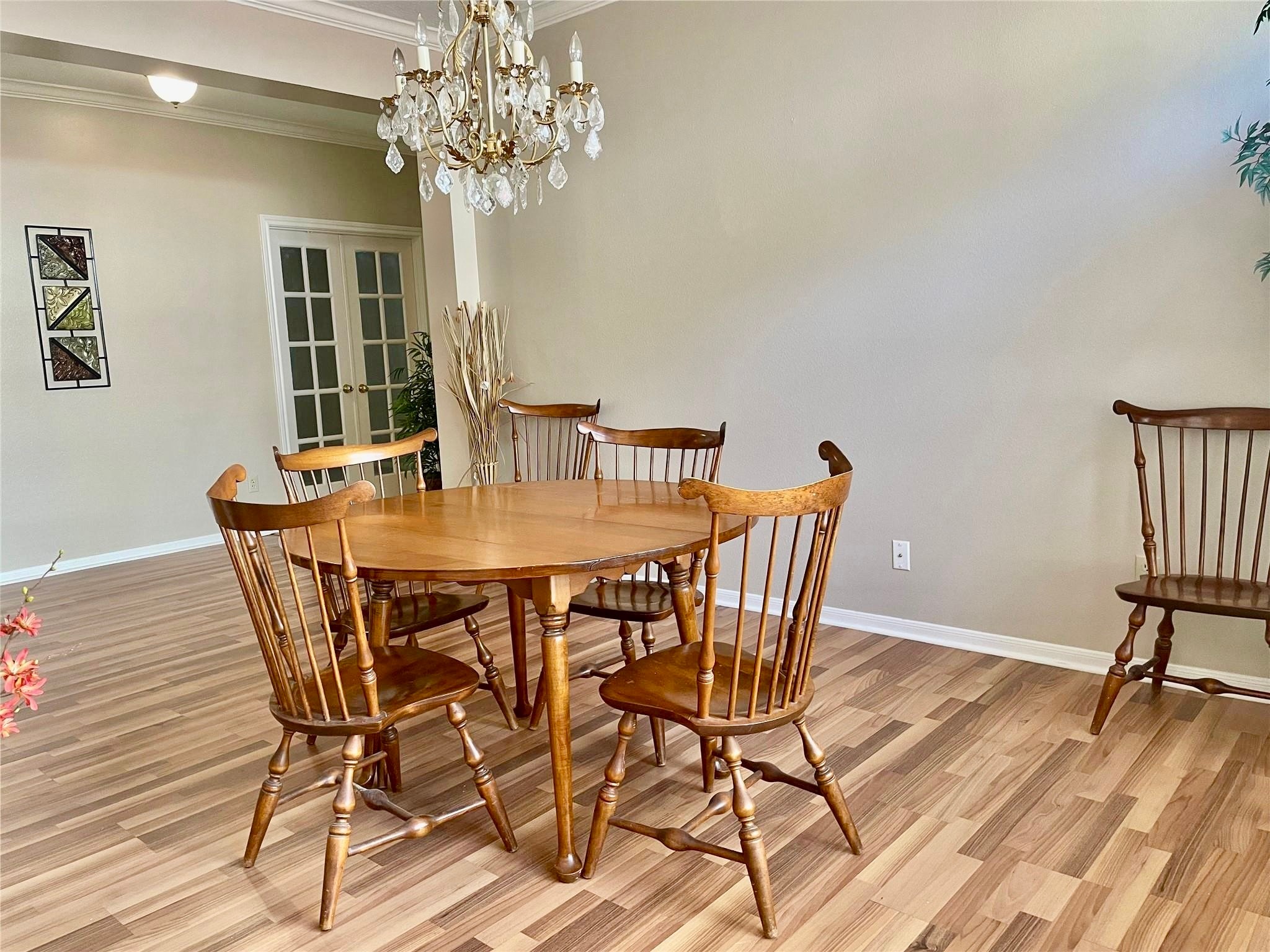 14527 Circlewood Way Houston, TX 77062 - Photo 9 of 14 a view of a dining room with furniture wooden floor and chandelier