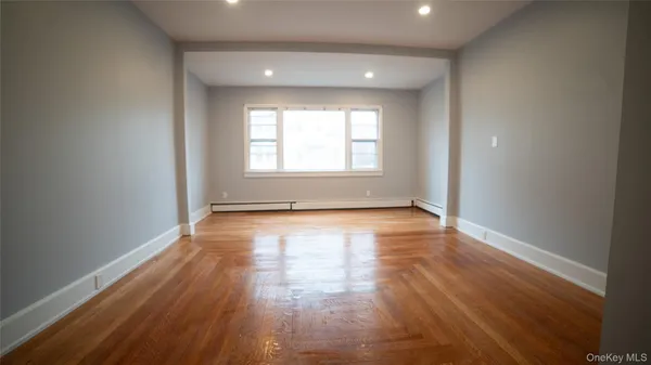 a view of a room with wooden floor and stairs