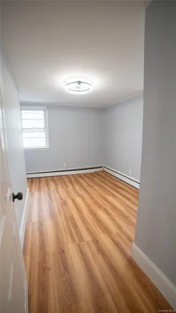 wooden floor and cabinet in a room