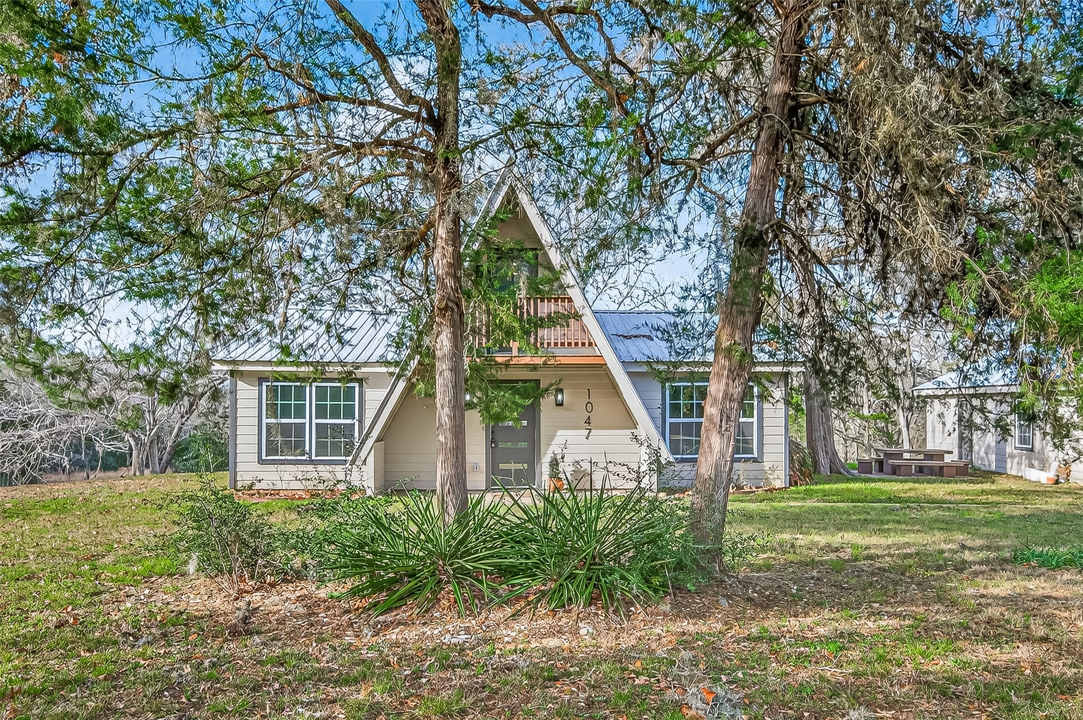1047 Dungens Mill Road Columbus, TX 78934 - Photo 3 of 44 a view of a house with backyard and trees