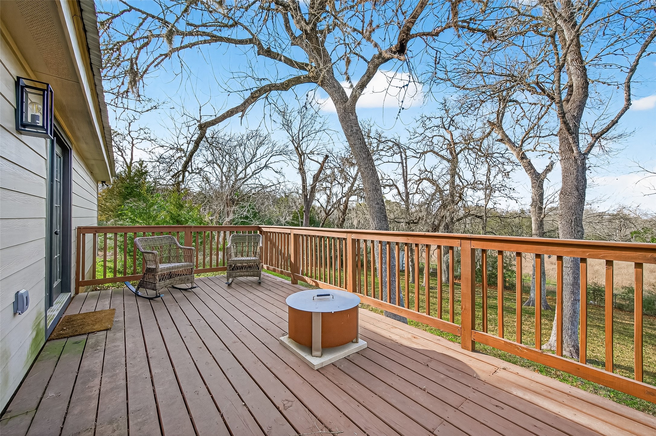 1047 Dungens Mill Road Columbus, TX 78934 - Photo 29 of 44 a view of balcony with wooden floor and fence