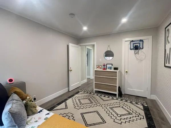 a bedroom with a bed and a dresser