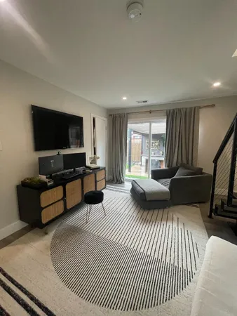 a bedroom with a bed and a couch