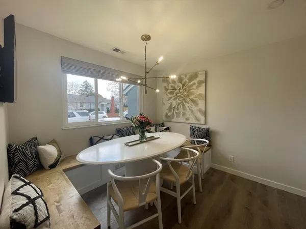 a view of a dining room with furniture window and outside view