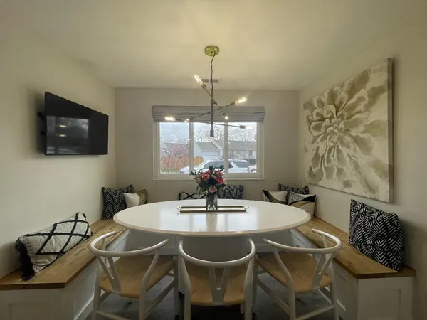 a dining room with furniture and window