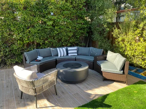 a view of a chairs and table in the patio