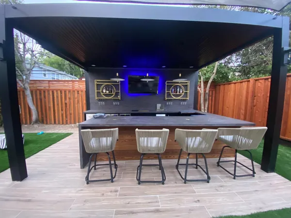 a view of a chairs and table in backyard