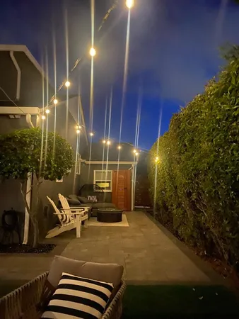 a building outdoor space with patio furniture and potted plants