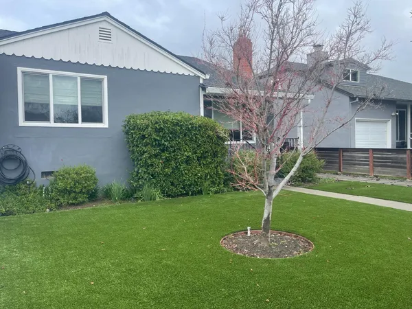 a front view of a house with garden