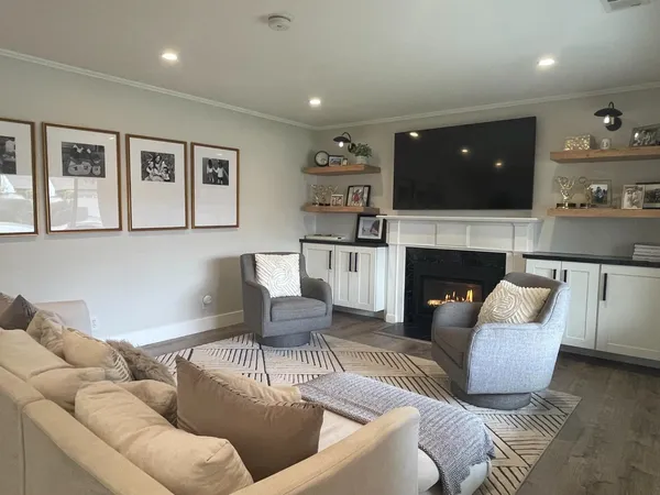 a living room with furniture and a fireplace