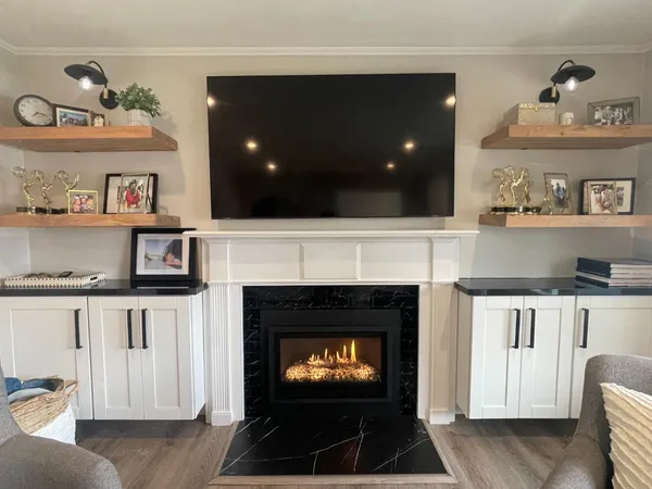 a living room with furniture and a fireplace