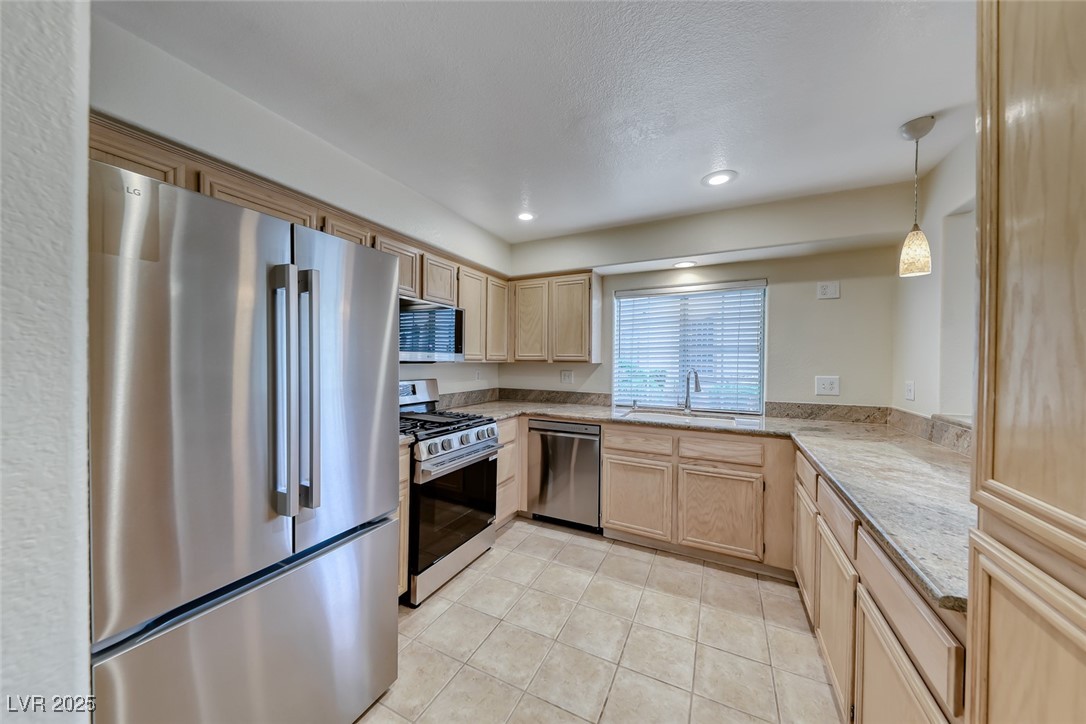 1851 Hillpointe Road, Unit 1811 Henderson, NV 89074 - Photo 11 of 49 Kitchen with granite countertops, recessed lighting and tile flooring.