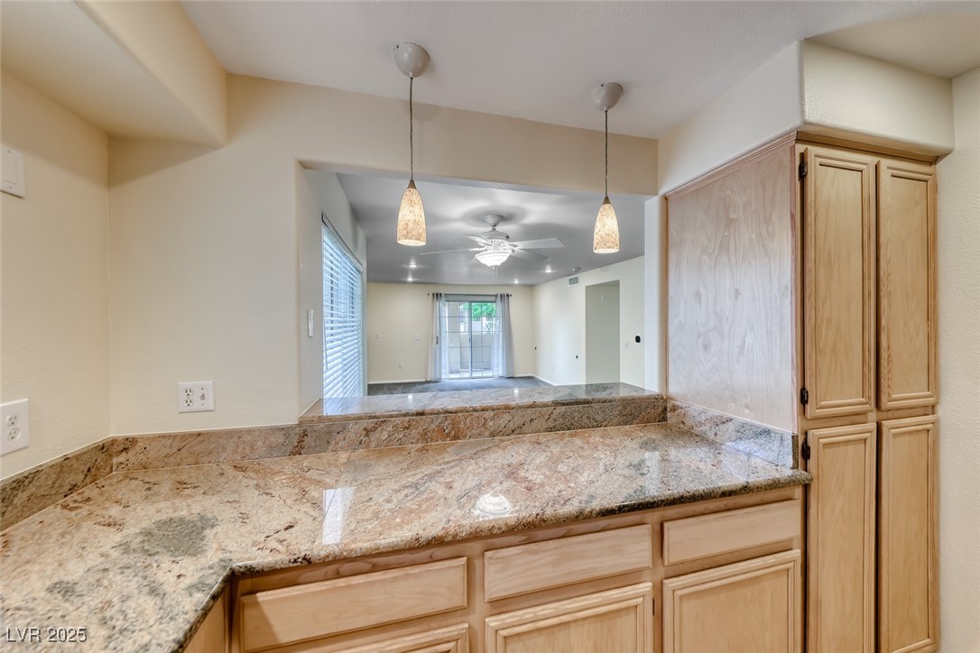 1851 Hillpointe Road, Unit 1811 Henderson, NV 89074 - Photo 15 of 49 Kitchen overlooking the dining room and living room